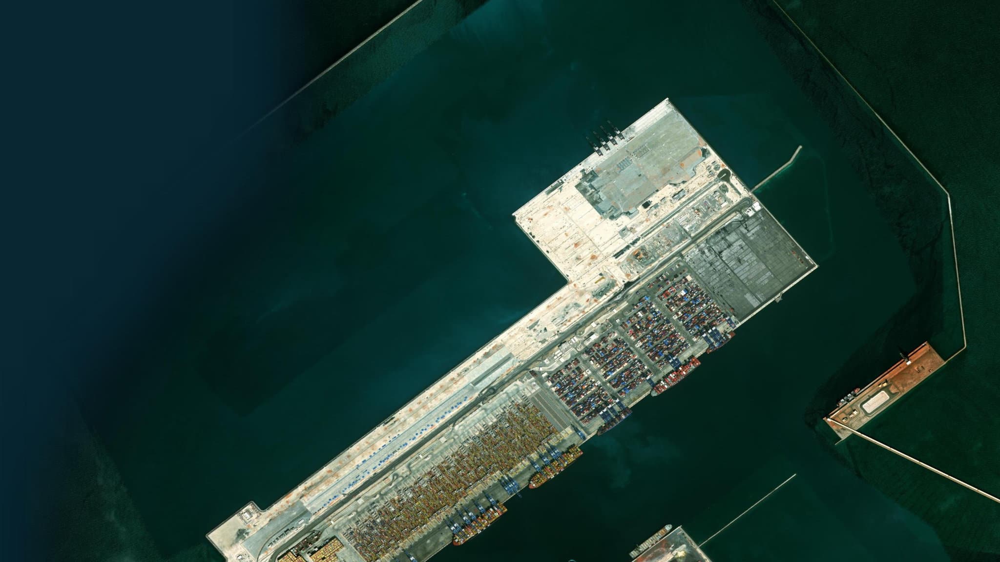 Aerial view of a busy container port and shoreline, a typical Cockpit area of interest